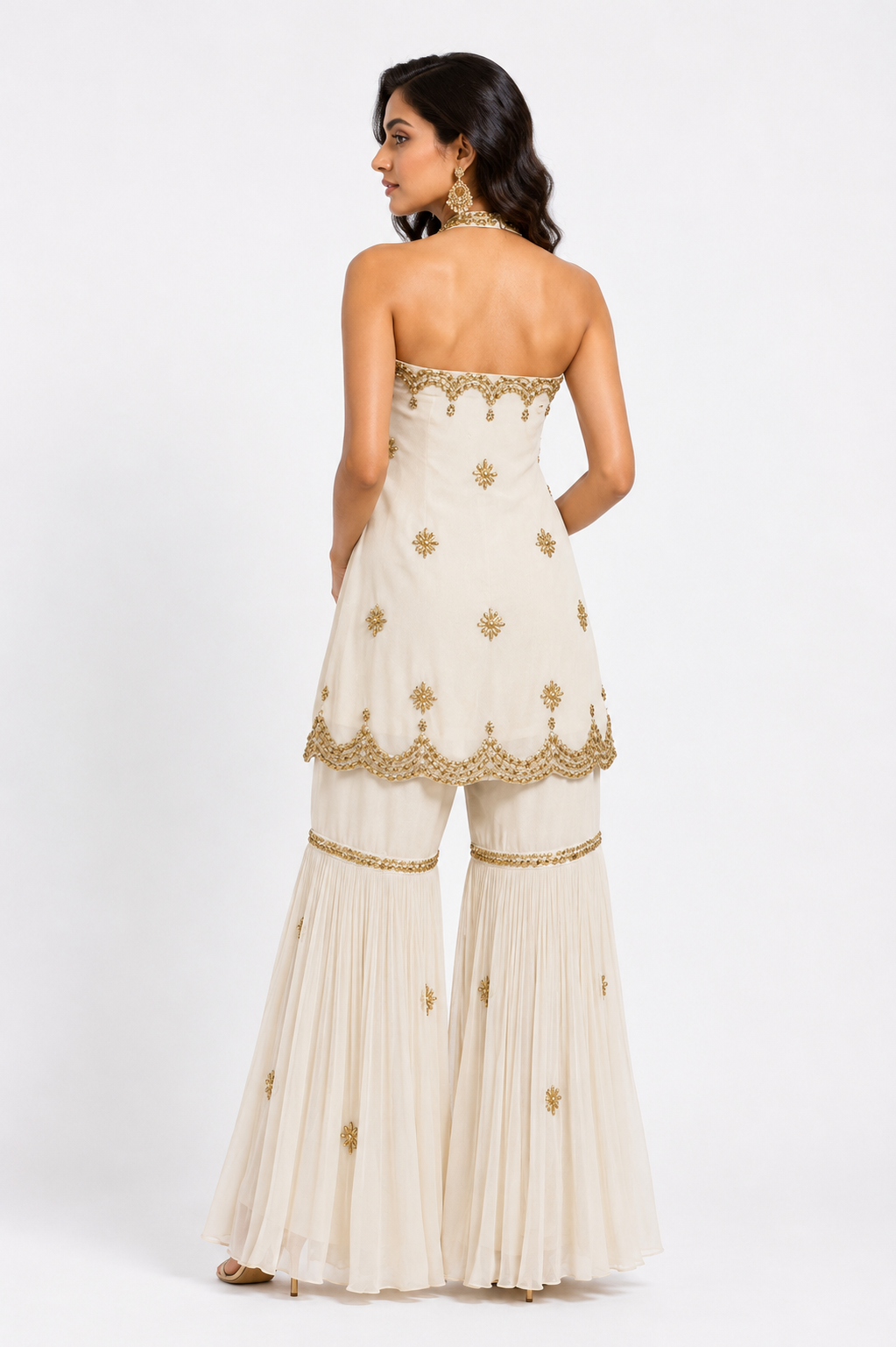 Back view of premium ivory gharara set with zari detailing by Bellissima