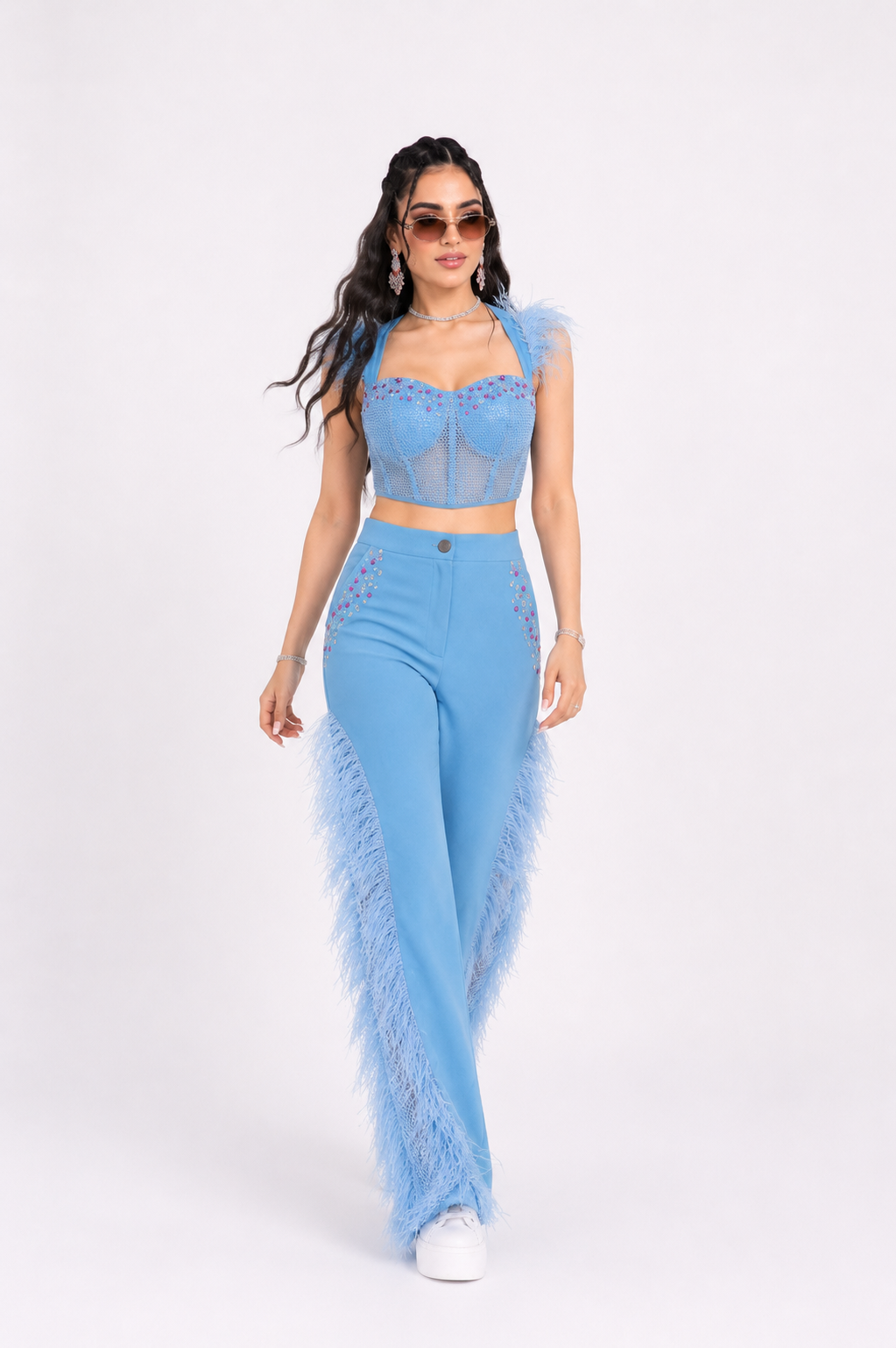 Luxury ice blue denim feather co-ord set for women in walking runway pose by Bellissima