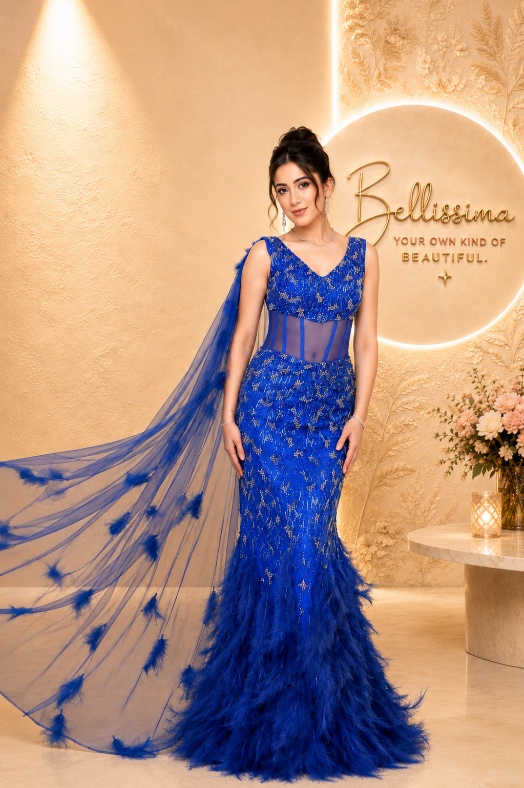 Bellissima Royal Sapphire Feather Gown in royal blue with feather detailing, embellished couture design and flowing drape for luxury evening wear