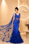 Bellissima Royal Sapphire Feather Gown in royal blue with feather detailing, embellished couture design and flowing drape for luxury evening wear