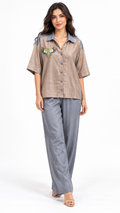 Taupe and steel grey bird-embroidered co-ord model pose 1